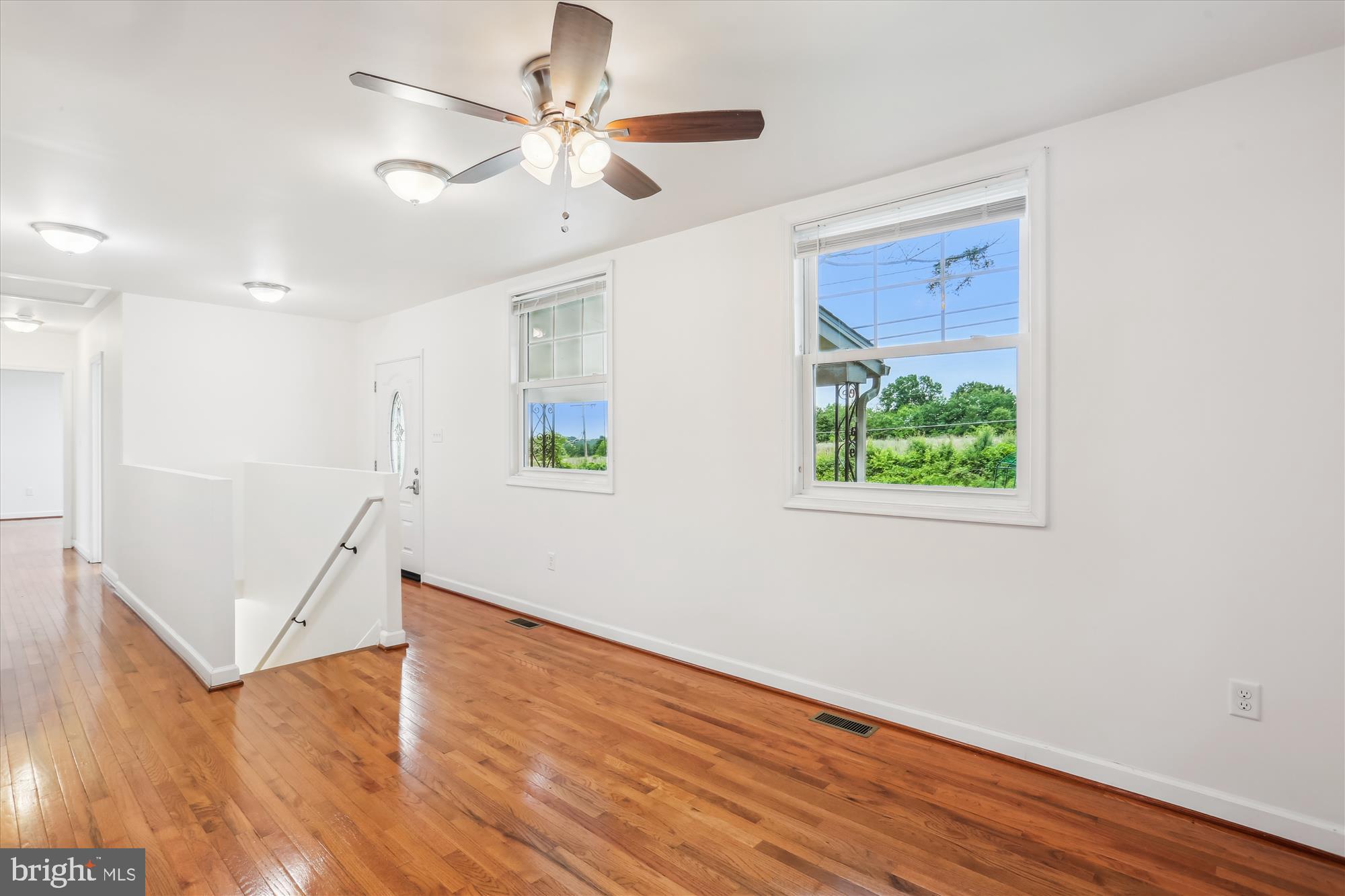 11008 Liberty Road Frederick, MD 21701 - Photo 10 of 39 wooden floor in an empty room with a window