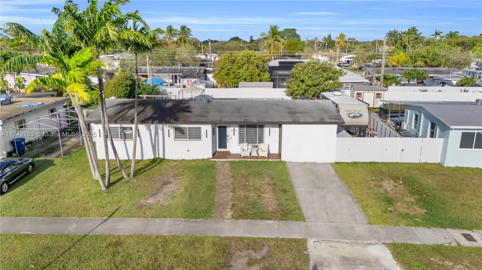 19900 Gulfstream Road Cutler Bay, FL 33157 - Photo 1 of 34 an aerial view of residential houses with yard