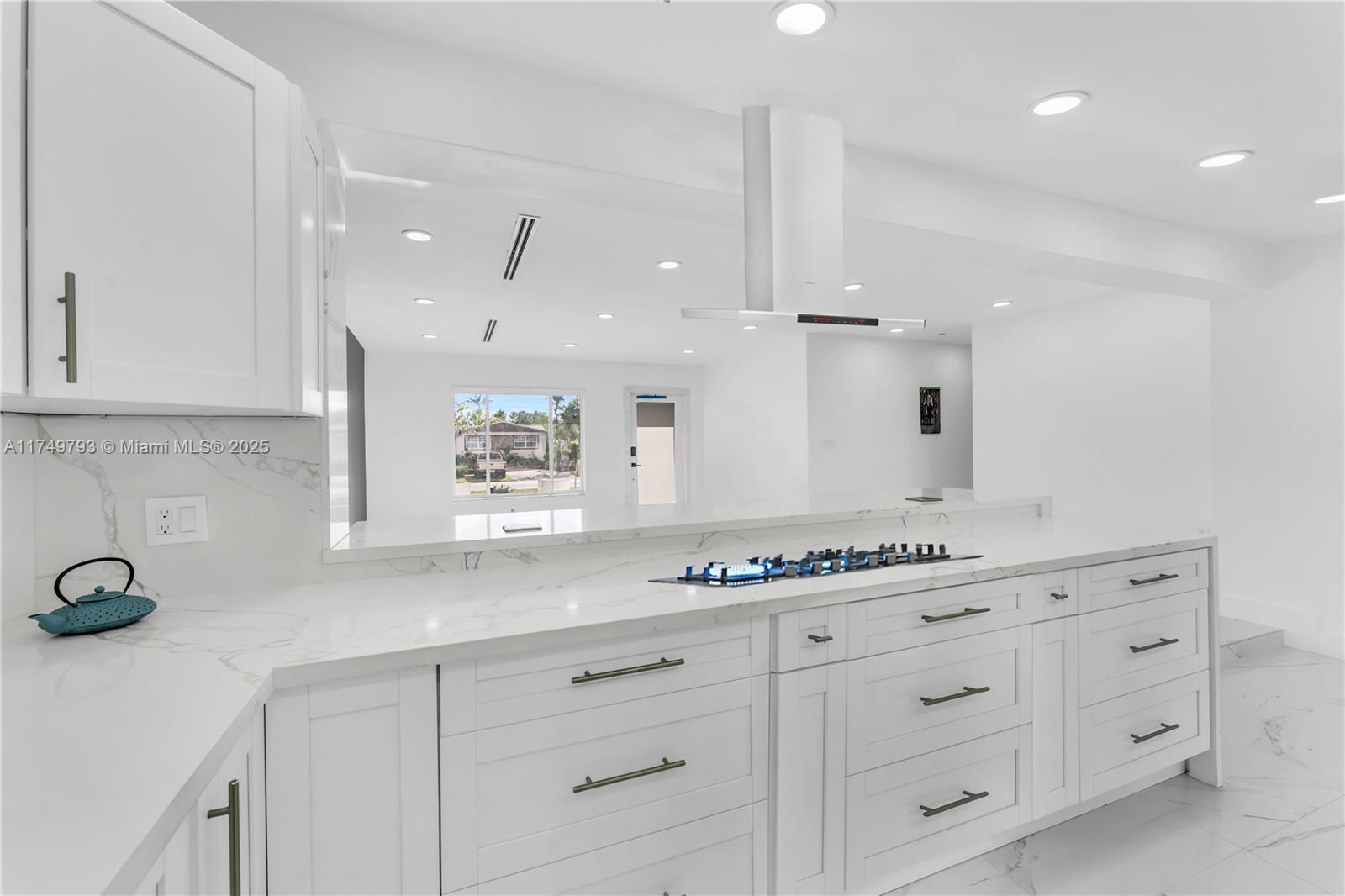 19900 Gulfstream Road Cutler Bay, FL 33157 - Photo 11 of 34 a bathroom with a granite countertop sink mirror and cabinets