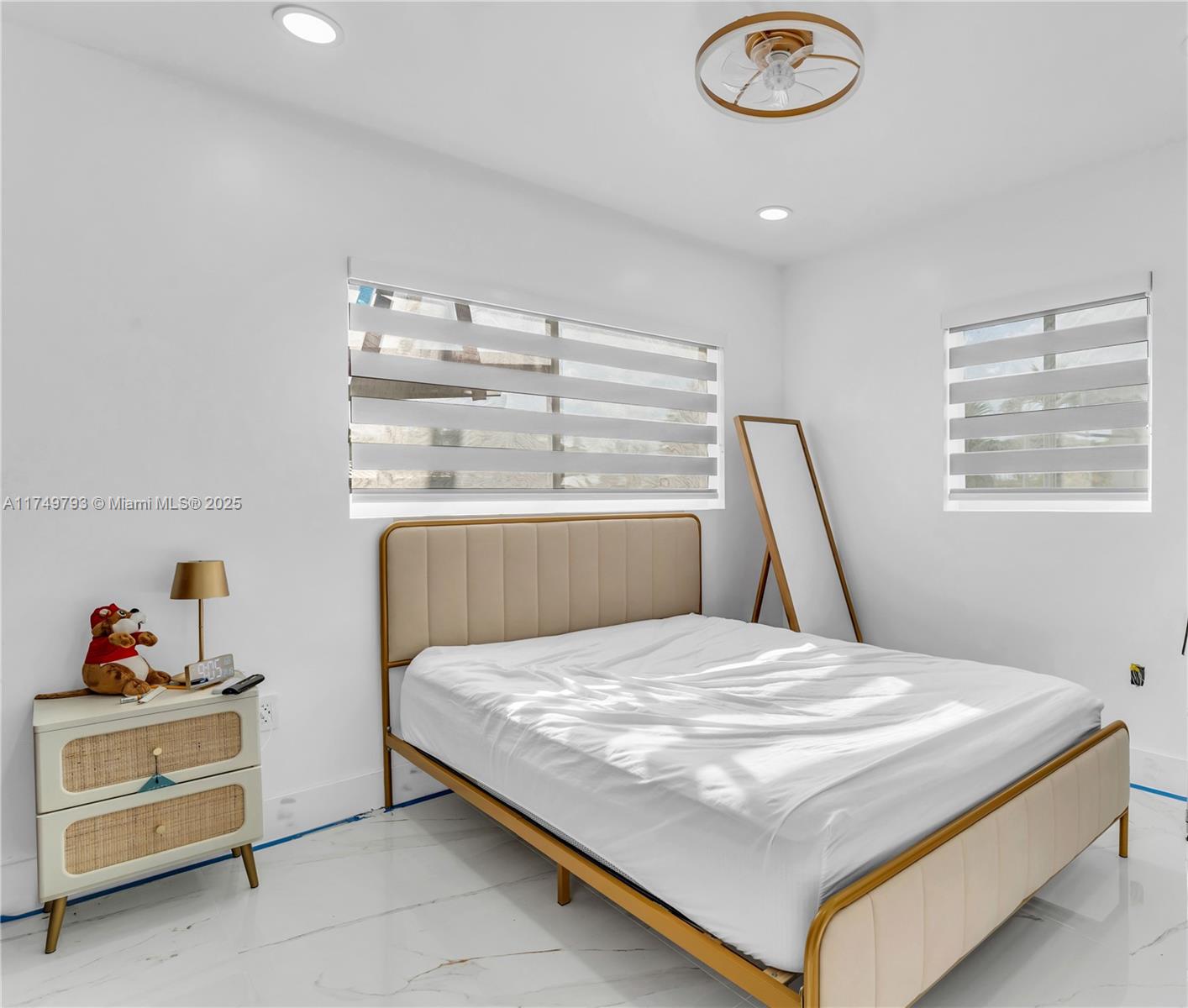 19900 Gulfstream Road Cutler Bay, FL 33157 - Photo 16 of 34 a bedroom with a bed and a window