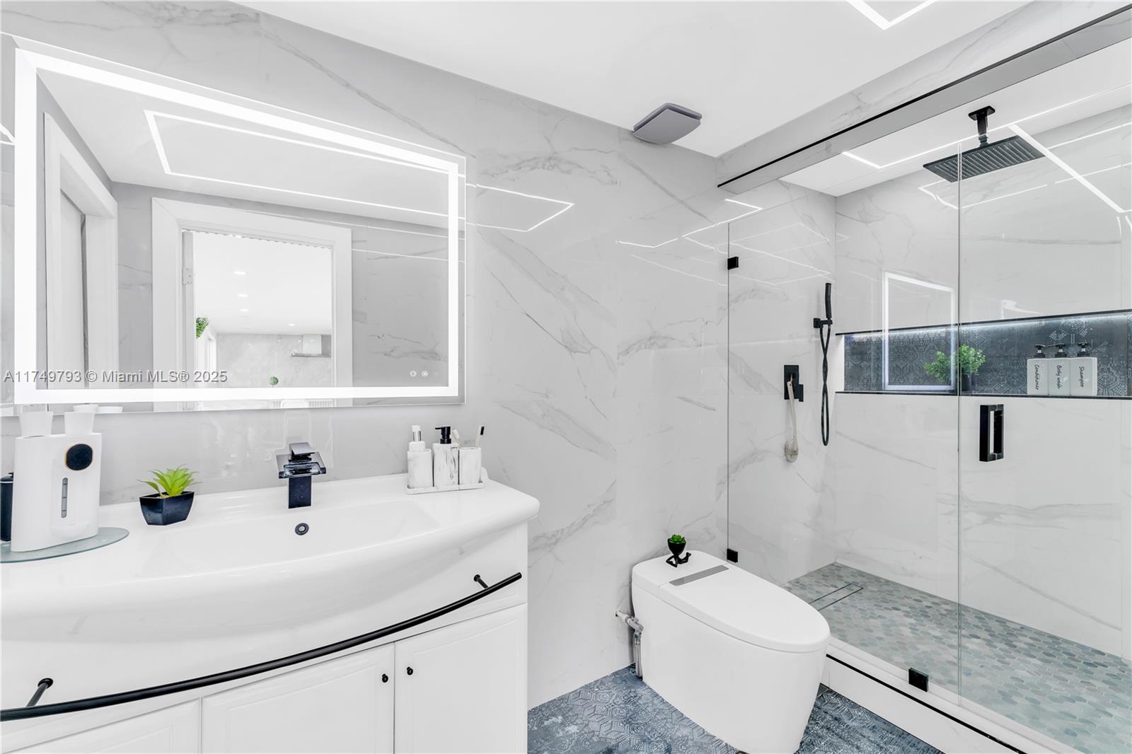 19900 Gulfstream Road Cutler Bay, FL 33157 - Photo 17 of 34 a bathroom with a sink toilet and shower