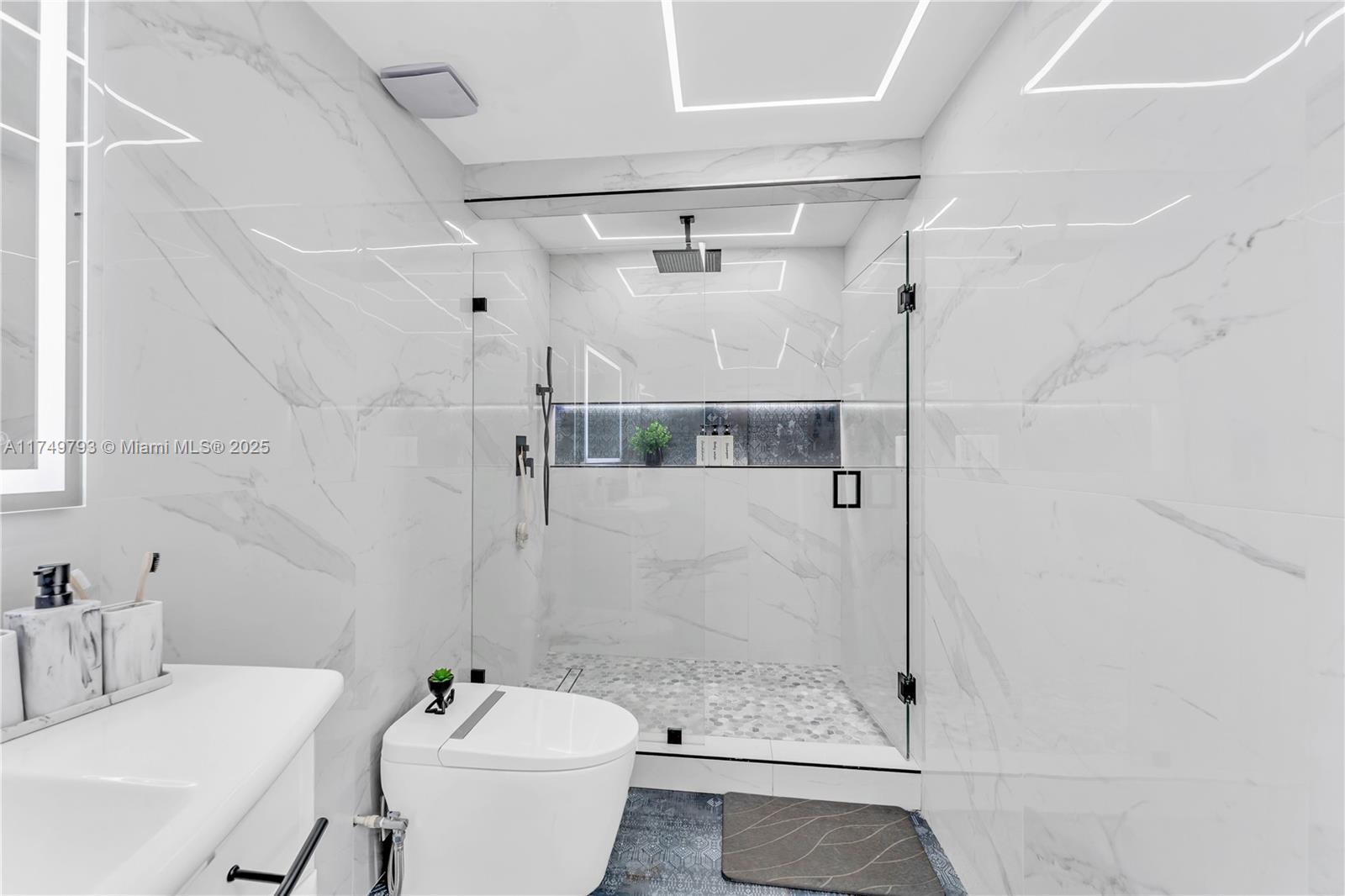 19900 Gulfstream Road Cutler Bay, FL 33157 - Photo 18 of 34 a bathroom with a sink toilet and shower