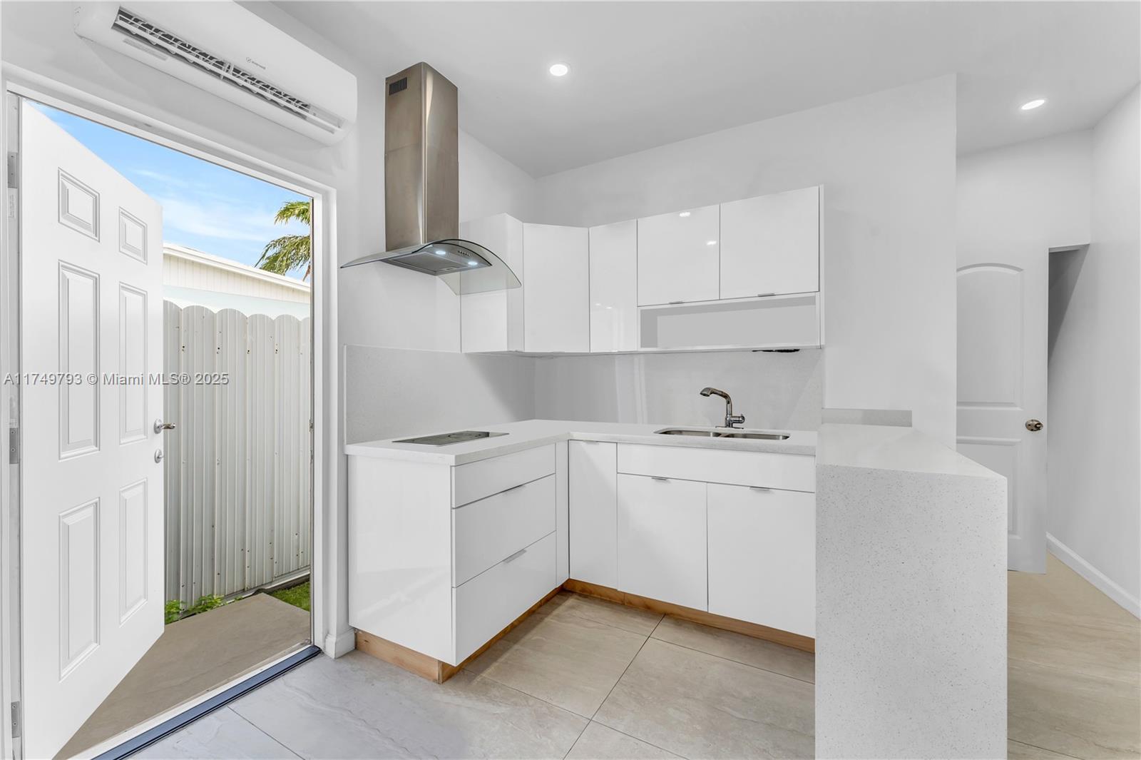 19900 Gulfstream Road Cutler Bay, FL 33157 - Photo 21 of 34 a kitchen with stainless steel appliances granite countertop a sink a stove and a refrigerator