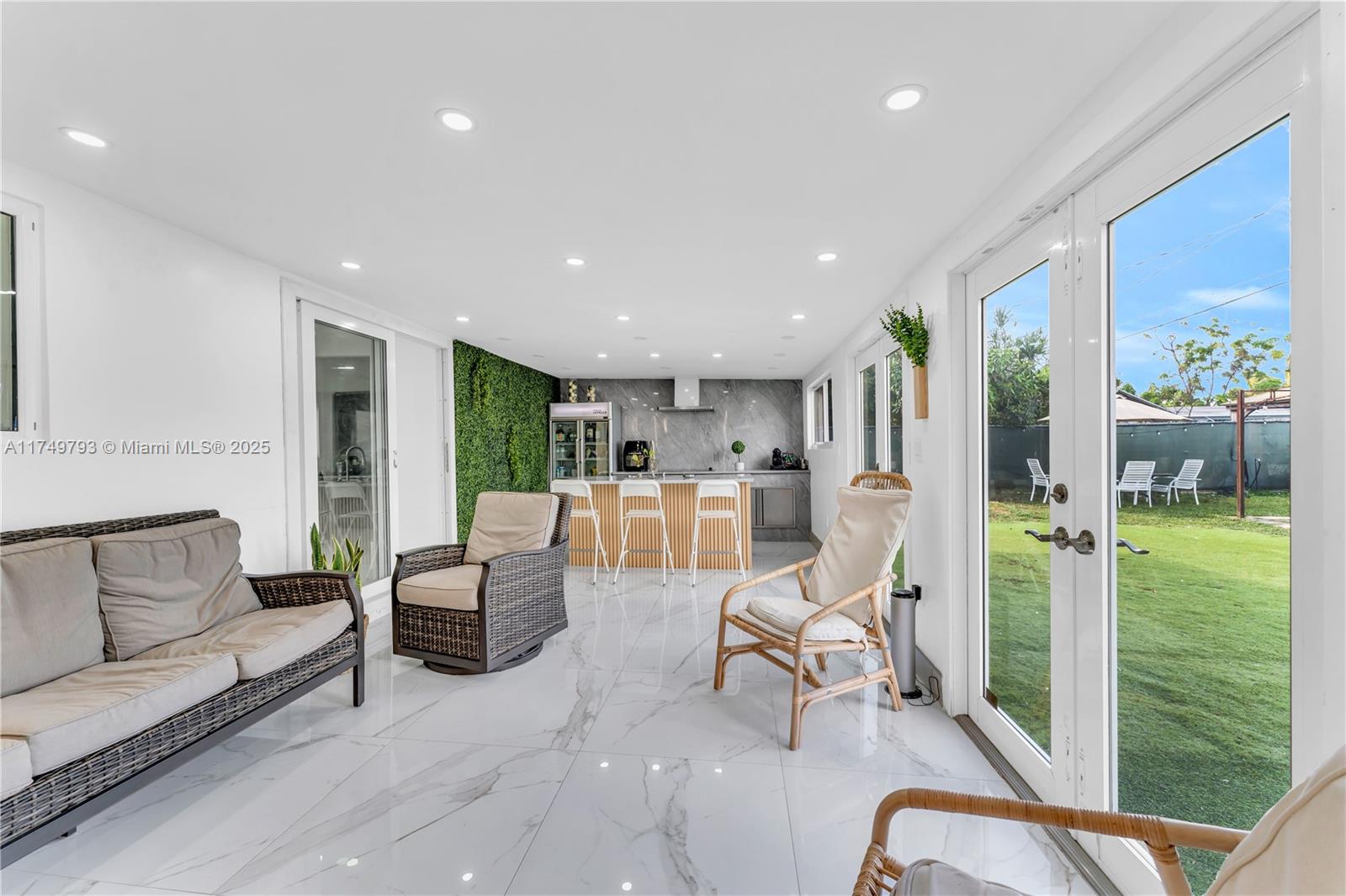 19900 Gulfstream Road Cutler Bay, FL 33157 - Photo 22 of 34 a living room with furniture floor to ceiling window and wooden floor