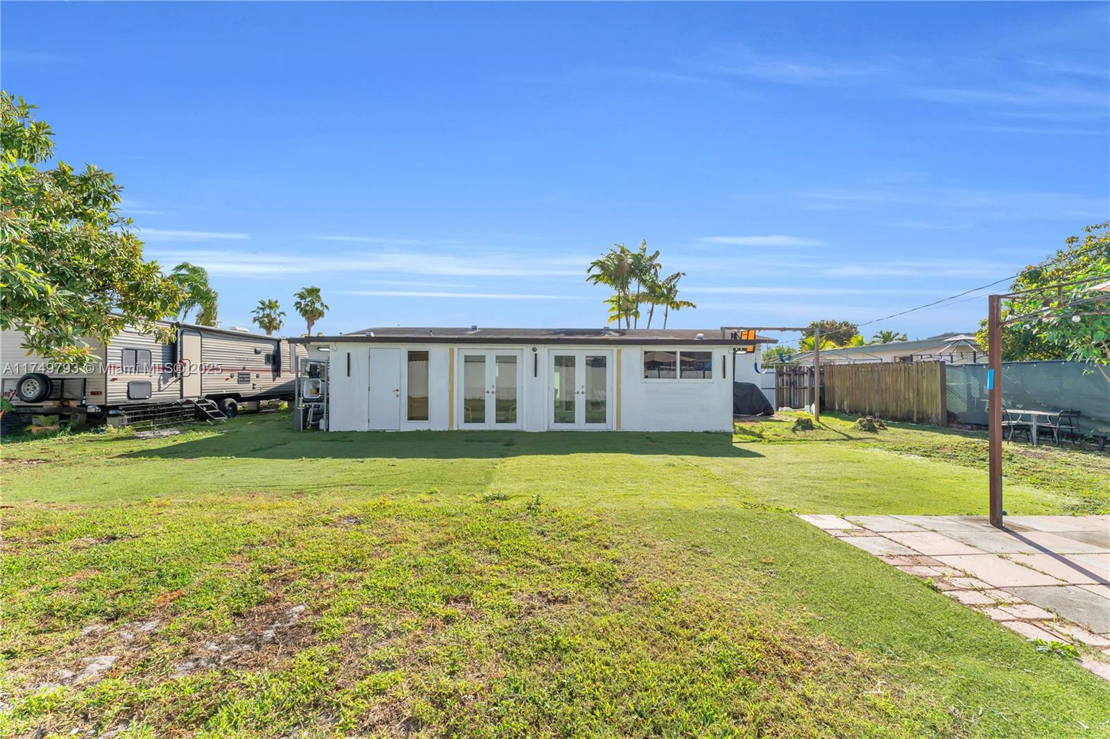 19900 Gulfstream Road Cutler Bay, FL 33157 - Photo 28 of 34 a front view of a house with a garden and yard