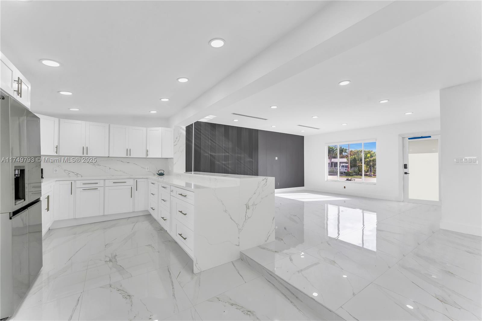 19900 Gulfstream Road Cutler Bay, FL 33157 - Photo 8 of 34 a large white kitchen with cabinets