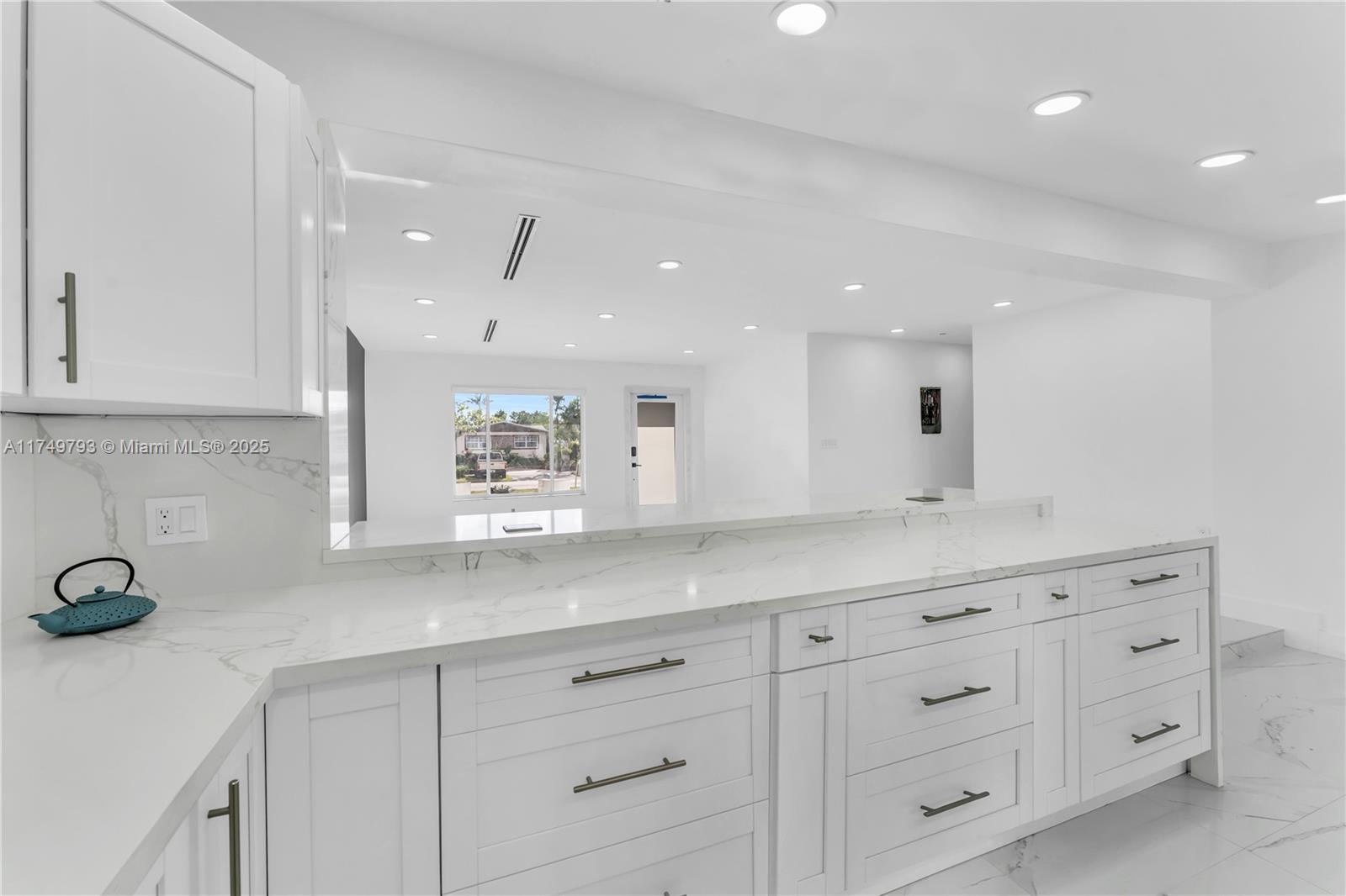 19900 Gulfstream Road Cutler Bay, FL 33157 - Photo 10 of 34 a kitchen with cabinets stainless steel appliances a sink and a counter top space