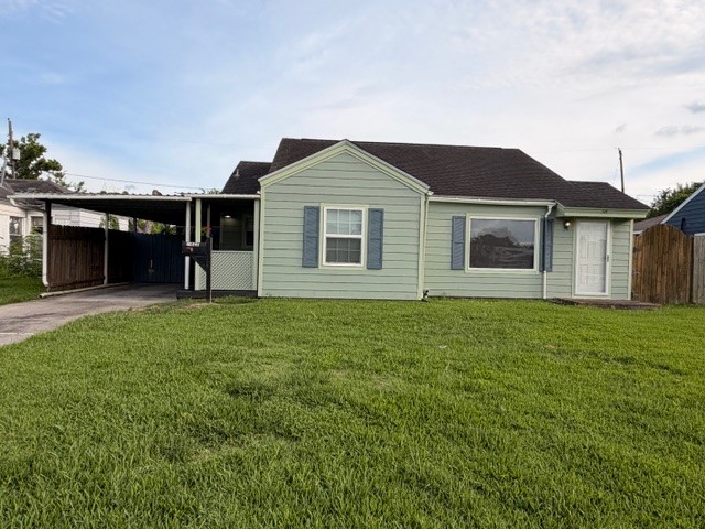 7422 Greenstone Street Houston, TX 77087 - Photo 1 of 15 a front view of house with yard and green space