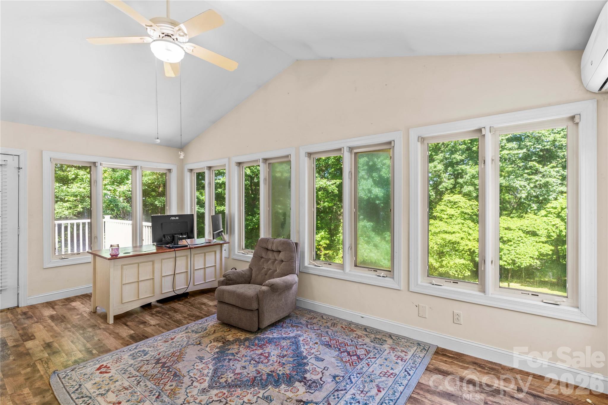 711 Spring Pointe Drive Stony Point, NC 28678 - Photo 10 of 47 a living room with furniture and large windows