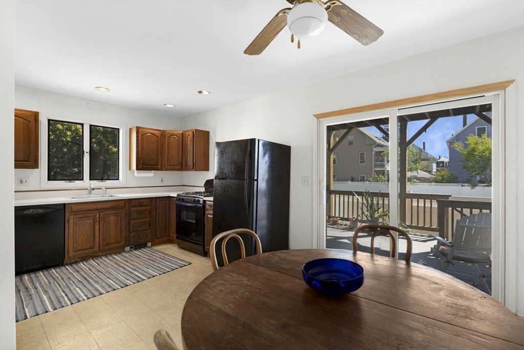 18 Briggs Street Salem, MA 01970 - Photo 21 of 43 a view of kitchen with sink refrigerator dining table and chairs