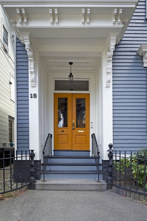 18 Briggs Street Salem, MA 01970 - Photo 3 of 43 a front view of a house with entryway and a window