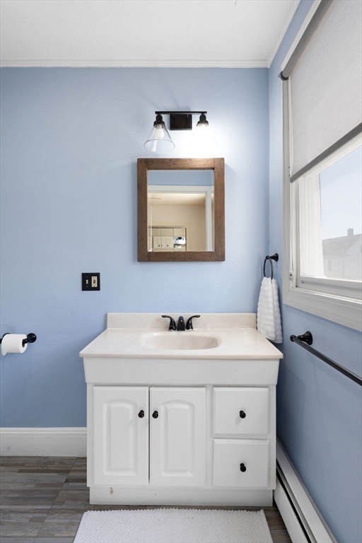 18 Briggs Street Salem, MA 01970 - Photo 35 of 43 a bathroom with a sink and a mirror