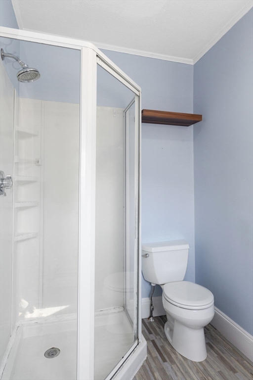 18 Briggs Street Salem, MA 01970 - Photo 36 of 43 a white toilet sitting next to a bath tub