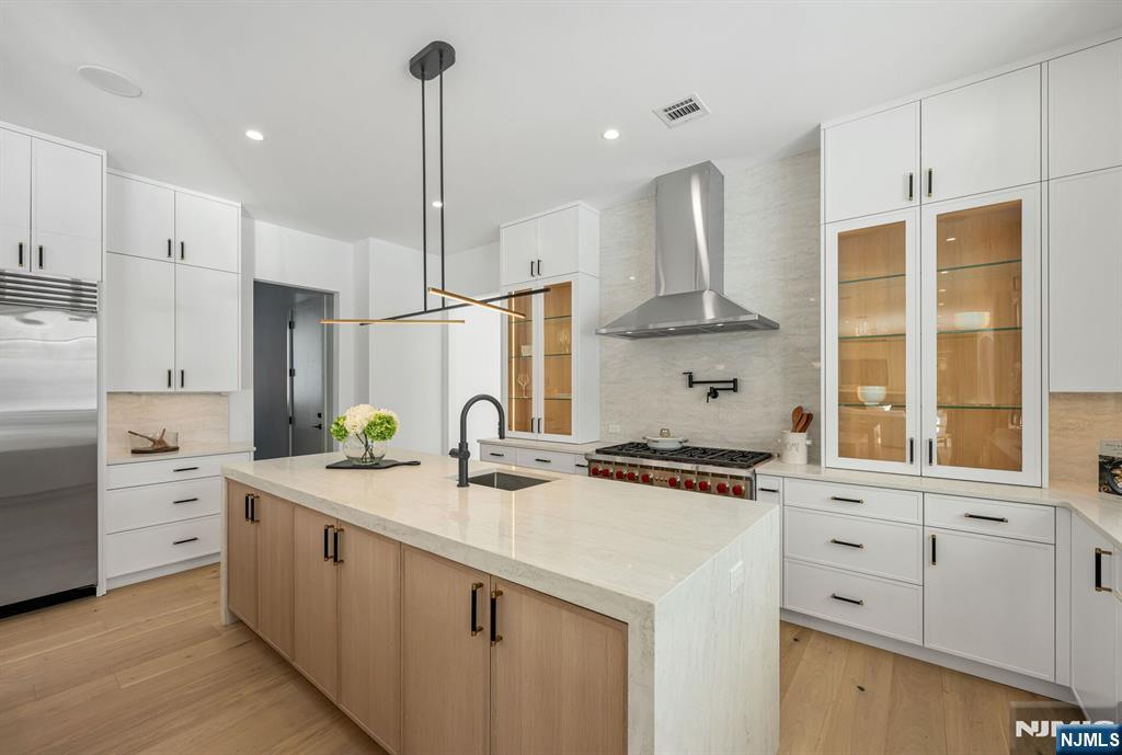 48 Brook Road Upper Saddle River, NJ 07458 - Photo 14 of 50 a kitchen with stainless steel appliances a sink stove and refrigerator