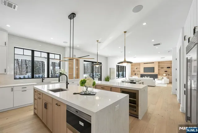 a white bath tub sitting in a bathroom next to a window