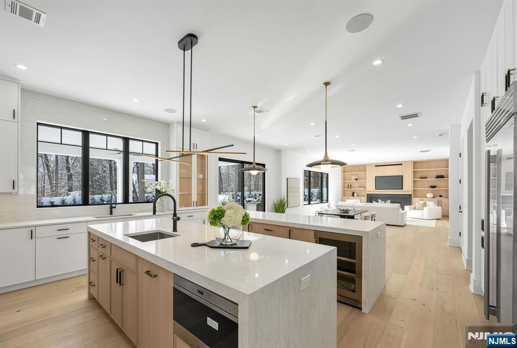 48 Brook Road Upper Saddle River, NJ 07458 - Photo 15 of 50 a kitchen with stainless steel appliances granite countertop a sink a stove and a wooden floors