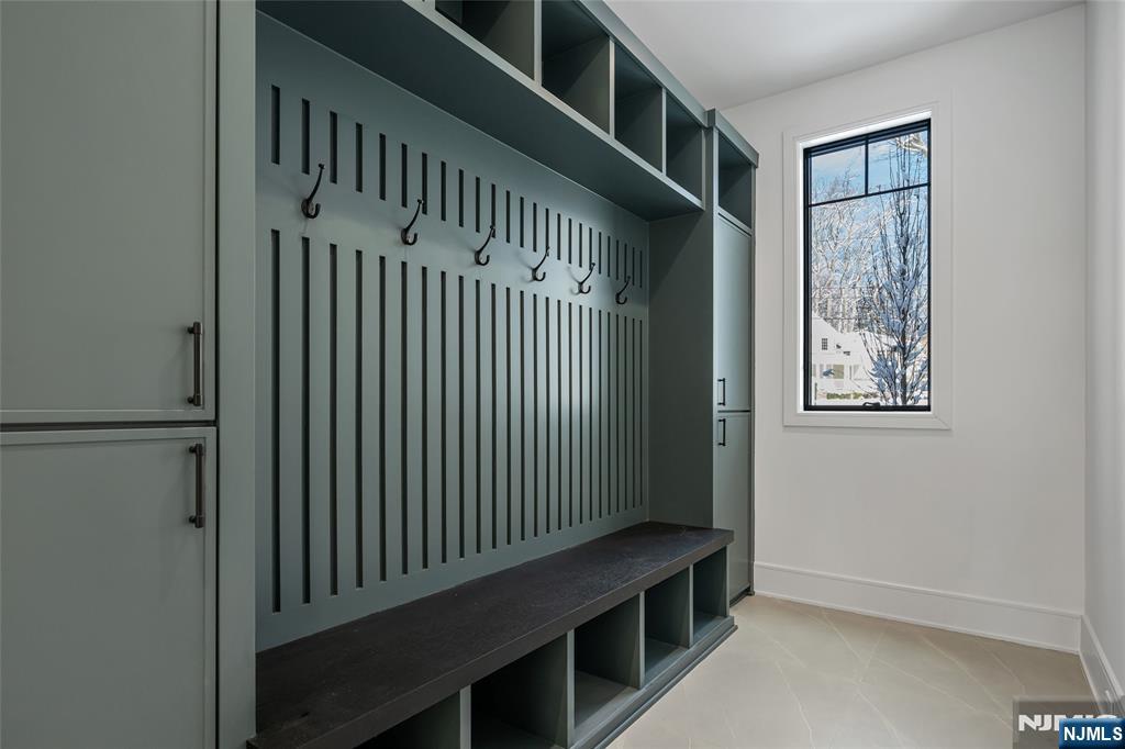 48 Brook Road Upper Saddle River, NJ 07458 - Photo 20 of 50 a view of staircase with white walls and a window