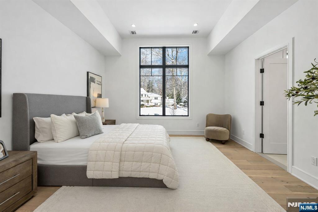 48 Brook Road Upper Saddle River, NJ 07458 - Photo 32 of 50 a bedroom with a bed and a window