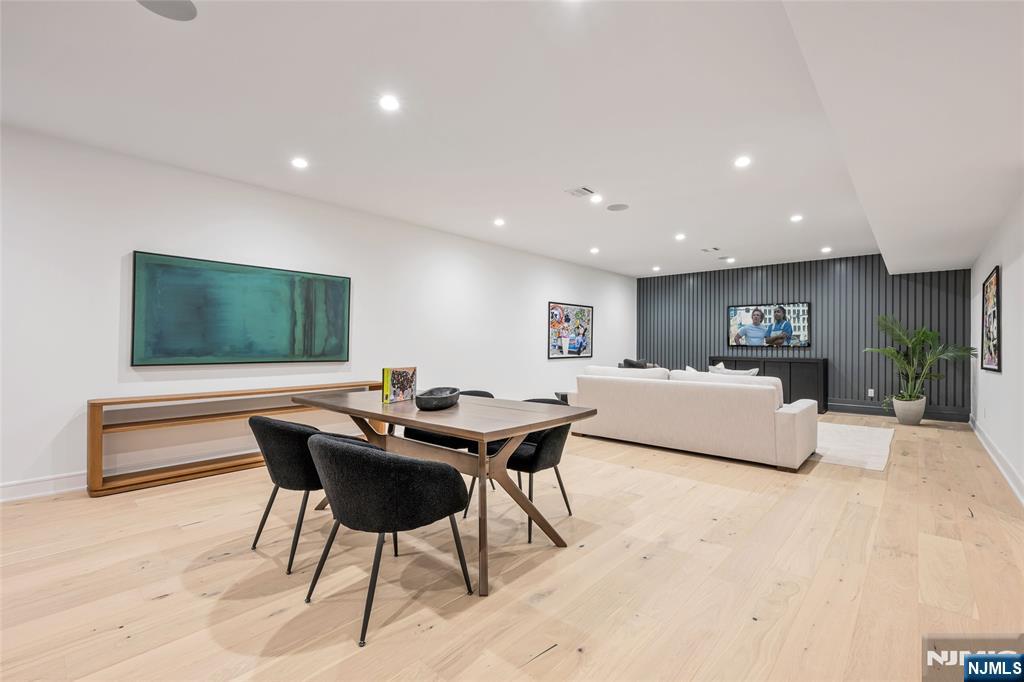 48 Brook Road Upper Saddle River, NJ 07458 - Photo 39 of 50 a living room with furniture a rug and a flat screen tv