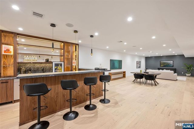 a kitchen with stainless steel appliances a sink and cabinets