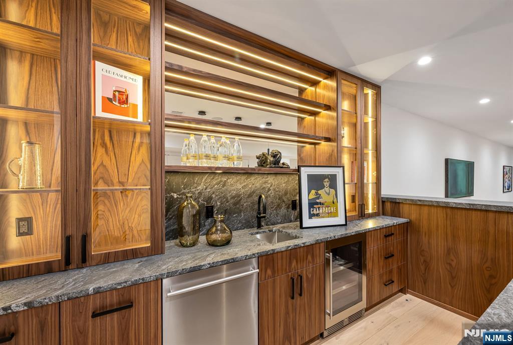 48 Brook Road Upper Saddle River, NJ 07458 - Photo 43 of 50 a kitchen with stainless steel appliances a sink and cabinets