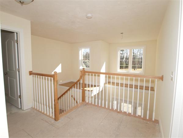 Lot 6 West Ledge Road Clinton, MA 01510 - Photo 12 of 19 a view of an empty room with wooden floor and windows