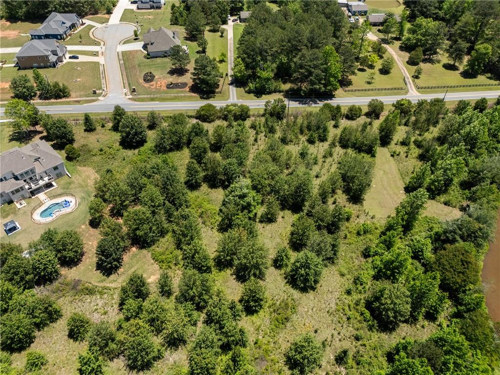 6707 Bishop Road Fairburn, GA 30213 - Photo 6 of 10 an aerial view of residential house with parking and trees