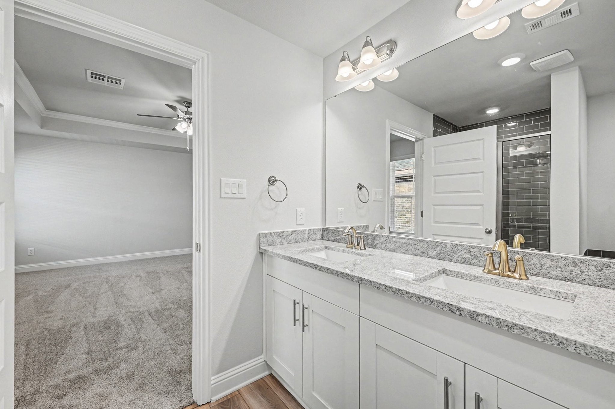 601 Greystone Lane Angleton, TX 77515 - Photo 22 of 32 a bathroom with a granite countertop sink and a mirror