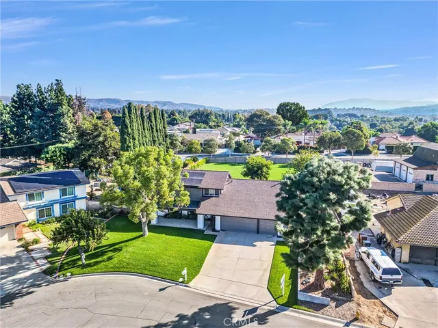 an aerial view of a house with a garden