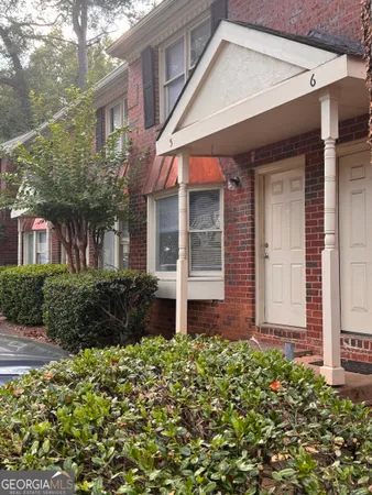 front view of a house with a small yard