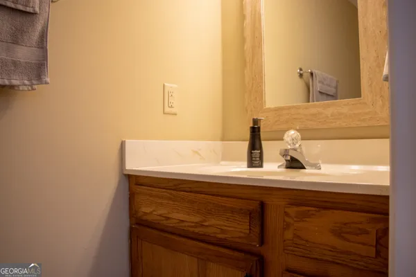 a bathroom with a sink and a mirror