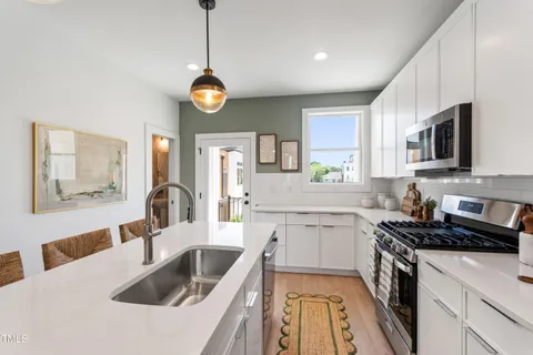 a bathroom with a sink and mirror