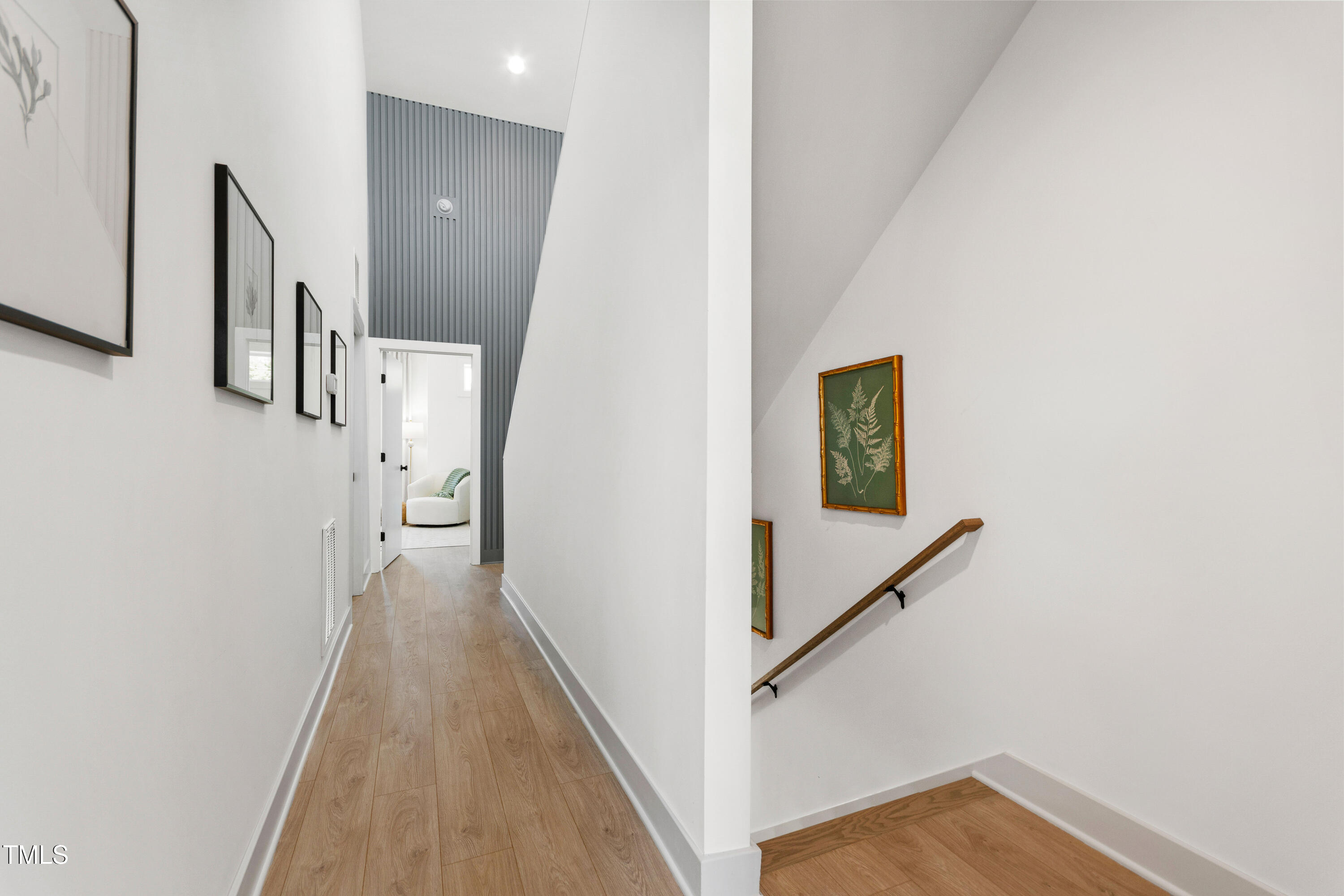 1313 Garner Road, Unit 101 Raleigh, NC 27610 - Photo 51 of 80 a view of a hallway with wooden floor and staircase