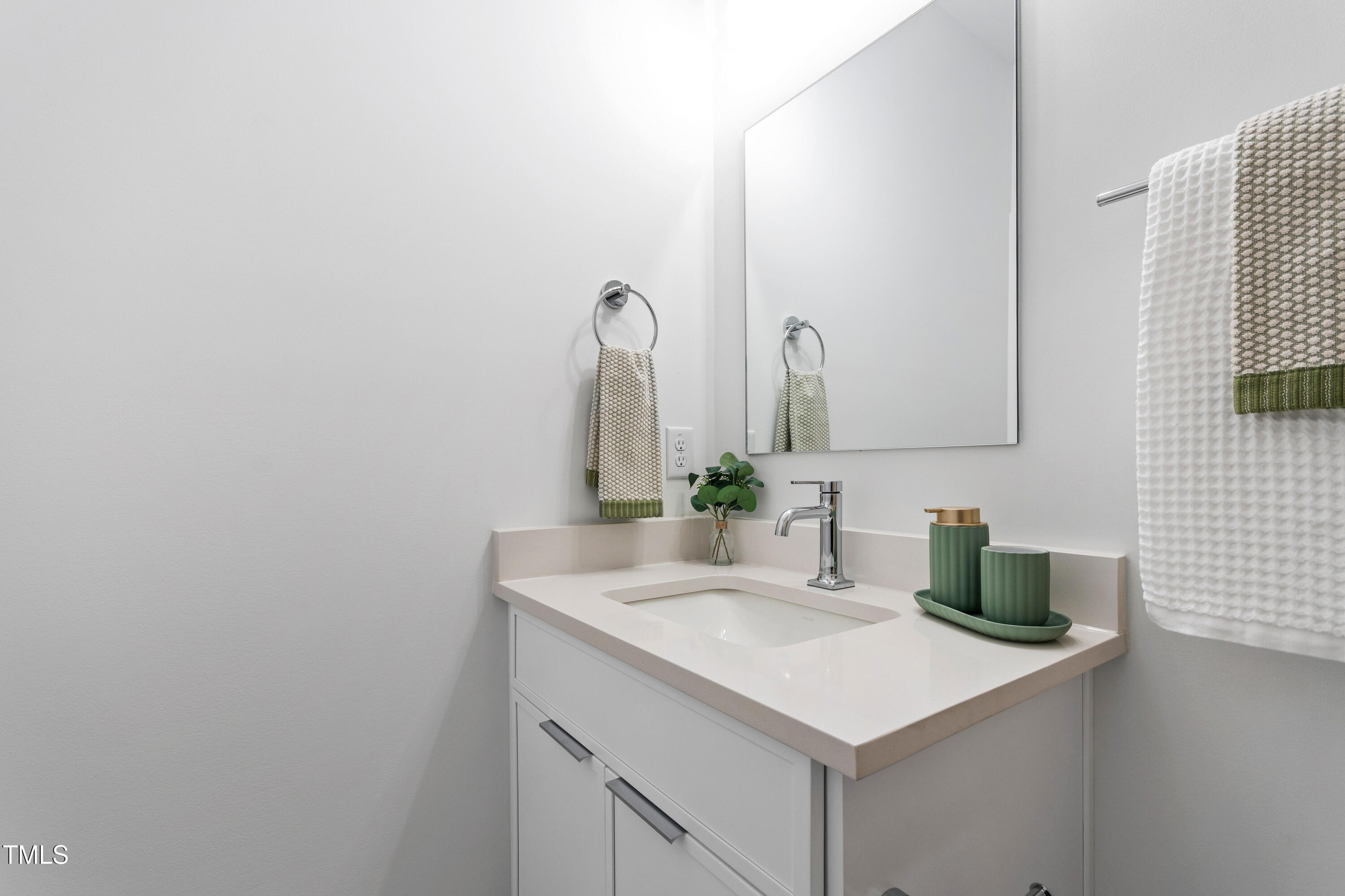 1313 Garner Road, Unit 101 Raleigh, NC 27610 - Photo 55 of 80 a bathroom with a sink and a mirror