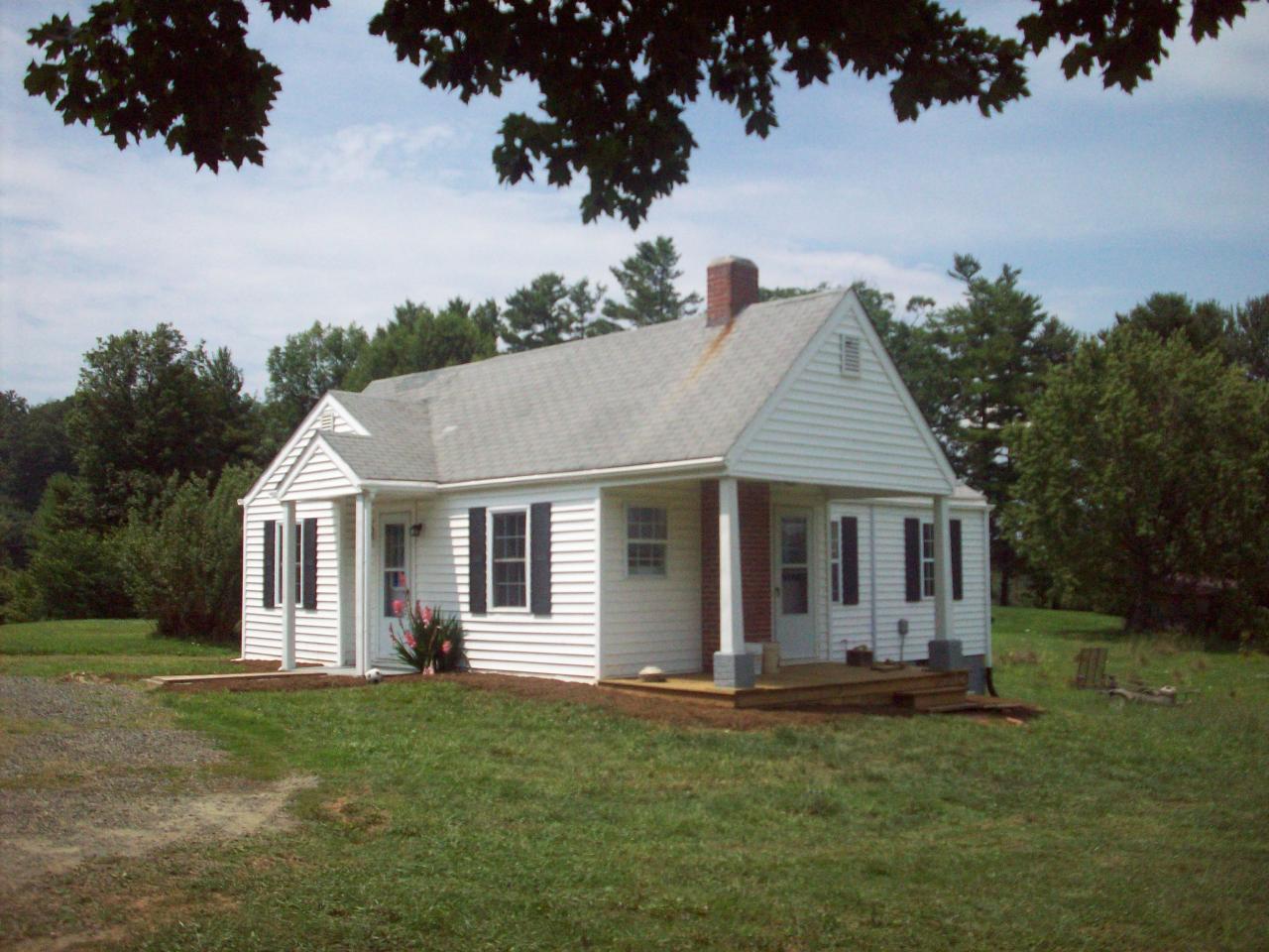 159 Conner Grove Road Southwest Willis, VA 24380 - Photo 1 of 5 a view of a house with a backyard