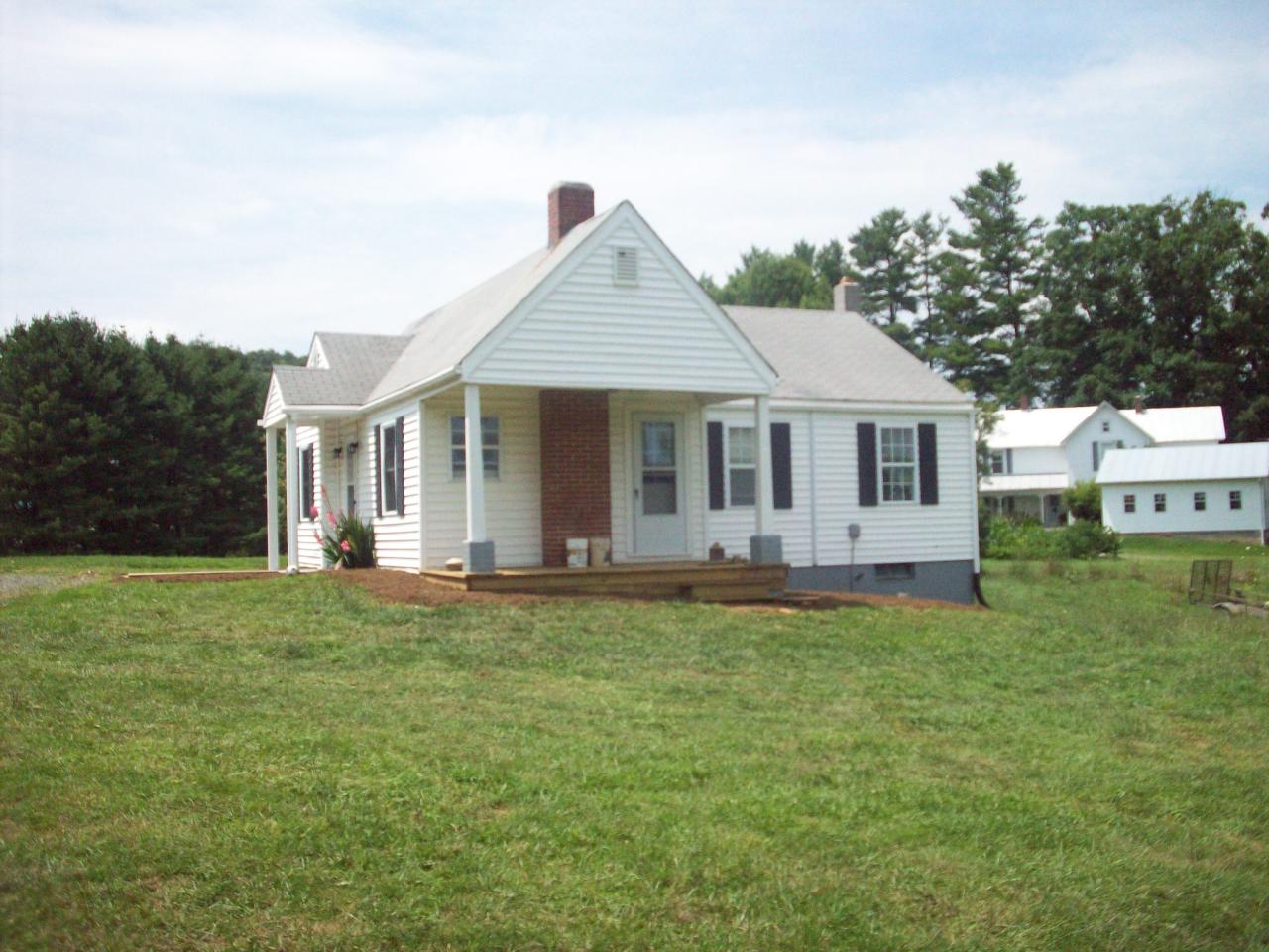 159 Conner Grove Road Southwest Willis, VA 24380 - Photo 4 of 5 a front view of a house with a garden