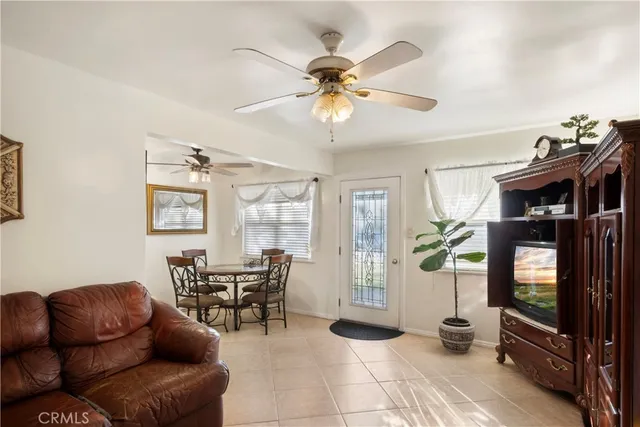 a kitchen with a sink refrigerator and cabinets