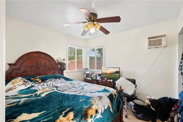 a bedroom with furniture and a window