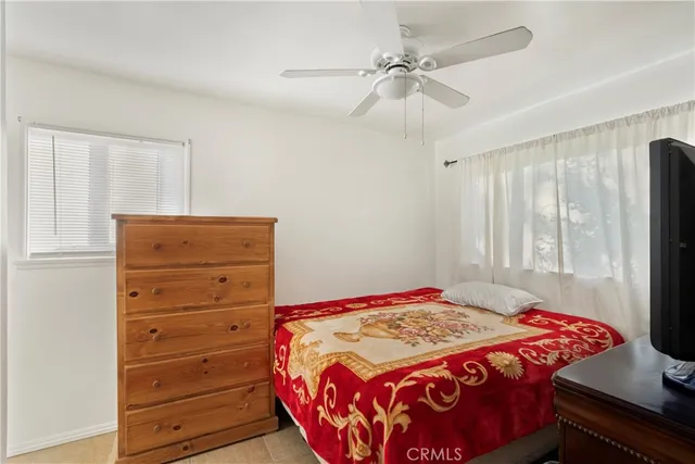 a view of bathroom with a toilet sink and mirror