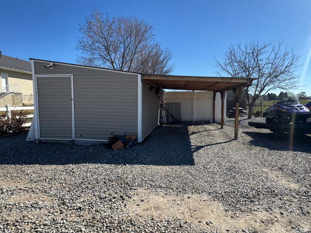 655 North 8th East Preston, ID 83263 - Photo 27 of 32 View of outdoor structure featuring an attached carport