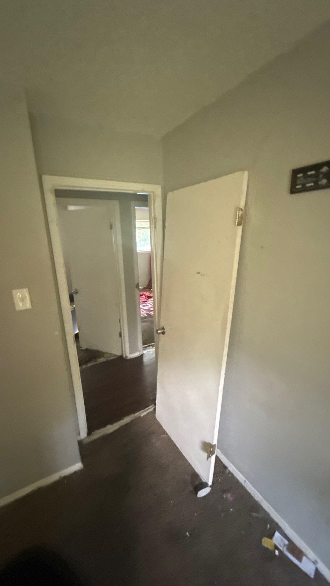 4939 Manson Road Memphis, TN 38109 - Photo 7 of 17 Interior hallway with light gray walls and dark flooring