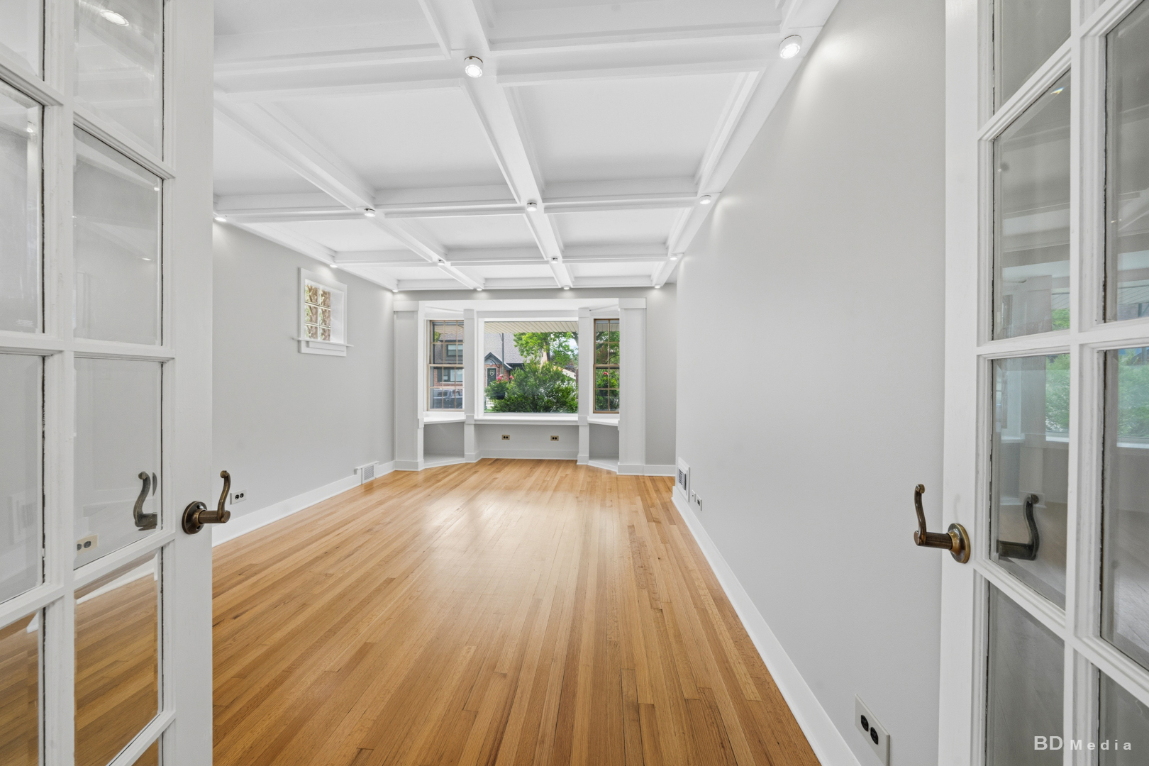 10428 South Springfield Avenue Chicago, IL 60655 - Photo 13 of 43 a view of an empty room with wooden floor and a window