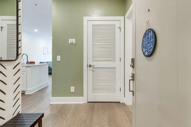 a view of a room with wooden floor