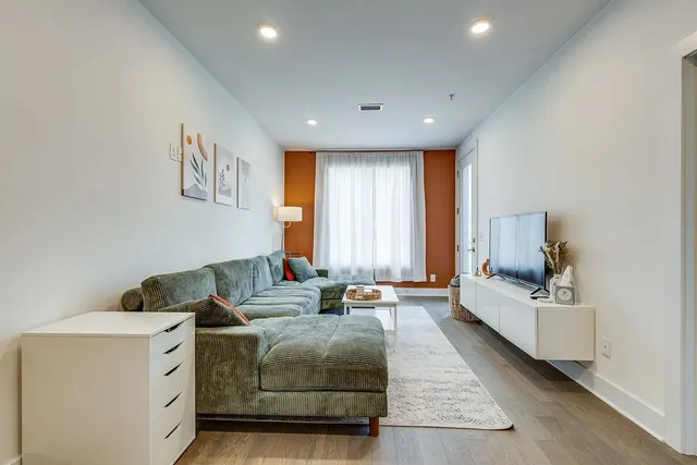 a bedroom with furniture and white walls