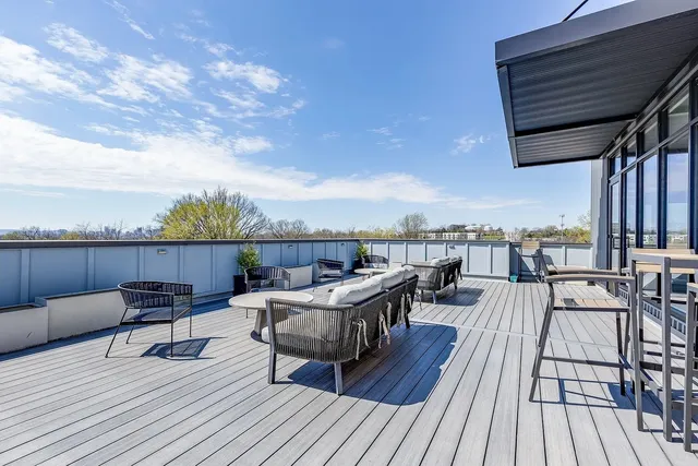 a view of roof deck with patio