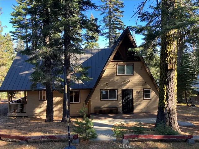 a front view of house with yard outdoor seating and yard