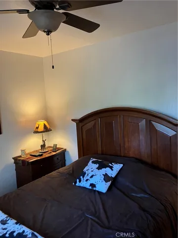 a view of a hallway with closet and a bathroom
