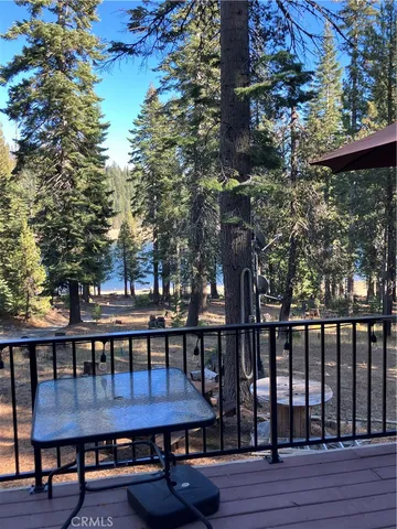 a view of house with backyard and deck