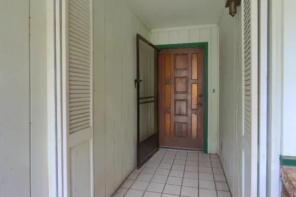 a view of a house with a yard and garage