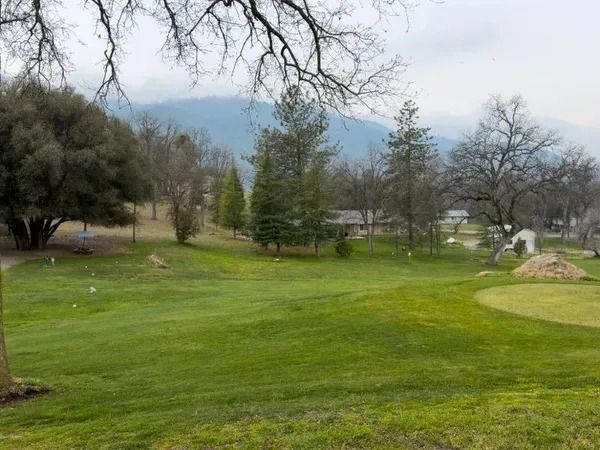 a view of a playground with basketball court